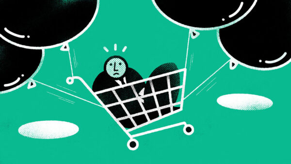 Man in a shopping basket suspended from baloons